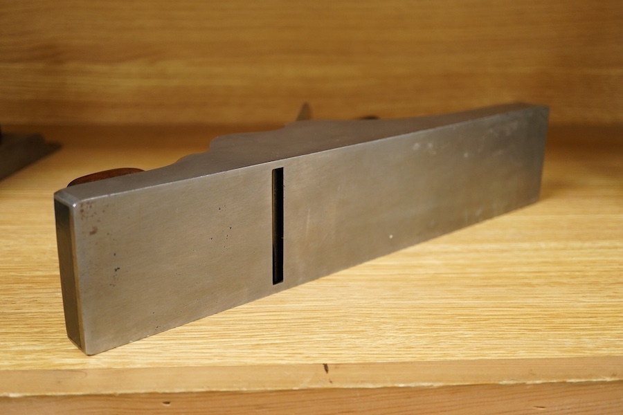 A Spiers dovetailed 14 1/2” panel plane, stamped with Spiers, Ayr to the brass lever cap and fitted with a Sorby iron, with rosewood infill